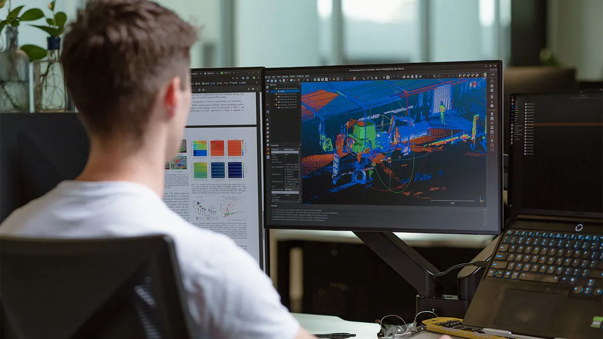 An engineer analysing a 3D LiDAR point-cloud scan of the ARC1 platform on-screen